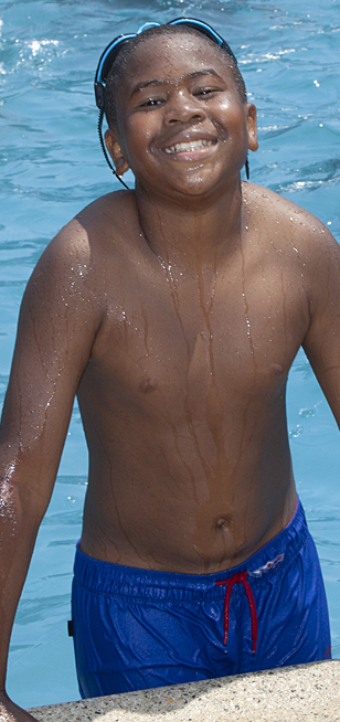 Boy in pool smiling